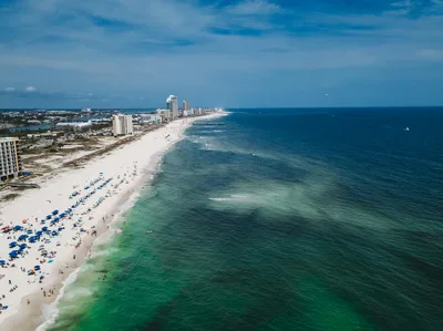 Aerial view of Gulf Shores Alabama coastline with high-rise buildings and white sand beaches