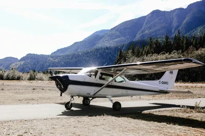 Cessna airplane on a scenic mountain runway, capturing the general aviation fly-in experience.