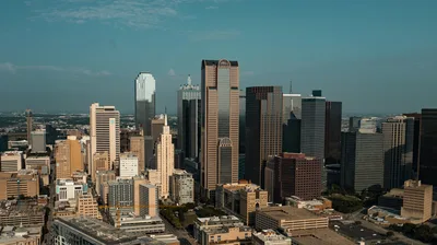 Aerial view of the Dallas skyline at dusk, showcasing the city's accessibility from Dallas Executive Airport.
