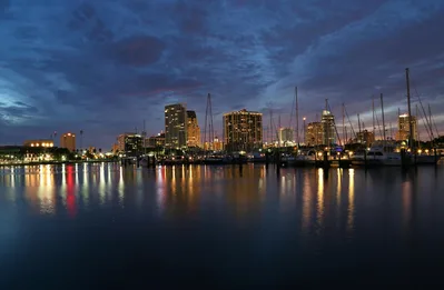 Dusk view of the St. Petersburg skyline and waterfront marina, adjacent to Albert Whitted Airport.
