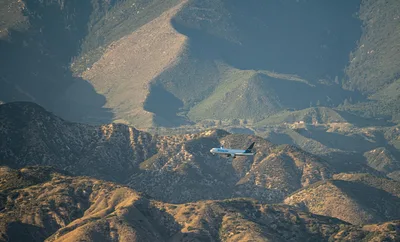Aerial view of an airliner flying over the scenic San Bernardino mountains near Redlands, California.